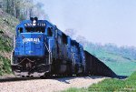 Conrail SD50 6769, leads a load of coal from Bailey mine and tops the grade at mp 11 on the MGA, Monongahela Railways Manor Branch, near Sycamore, Pennsylvania. May 17, 1989. 